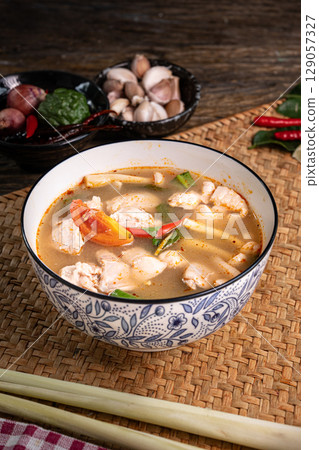 The Hot and Sour Chicken Soup or Tom Yum Gai for Thai food and cooking concept The Hot and Sour Chicken Soup or Tom Yum Gai for Thai food and cooking concept 129057327