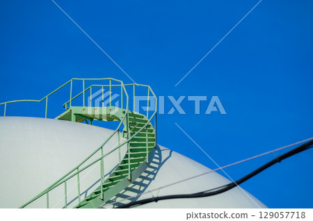 Storage tank stairs and blue sky Storage tank stairs and blue sky 129057718