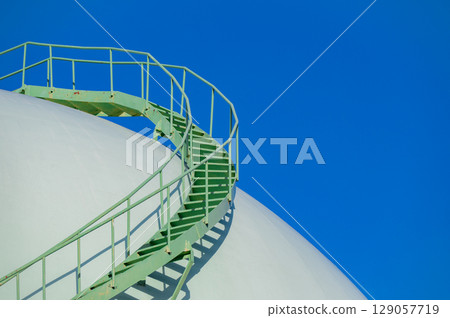 Storage tank stairs and blue sky Storage tank stairs and blue sky 129057719
