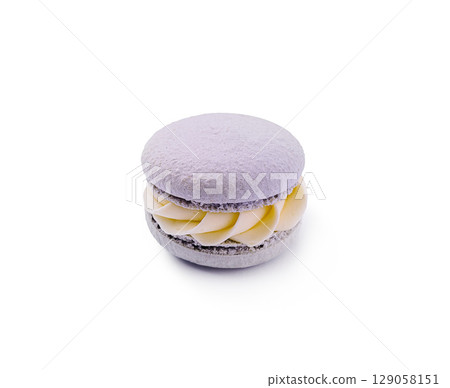 Lavender macaron with creamy filling presented on a white background 129058151