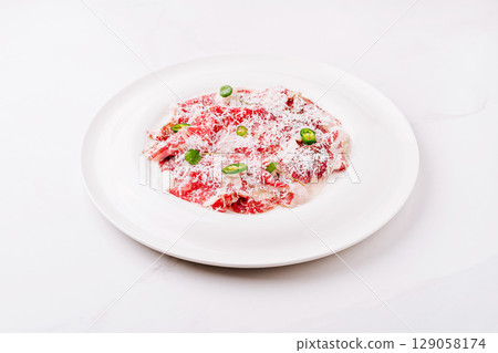 Deliciously prepared beef dish garnished with herbs and spices Deliciously prepared beef dish garnished with herbs and spices 129058174