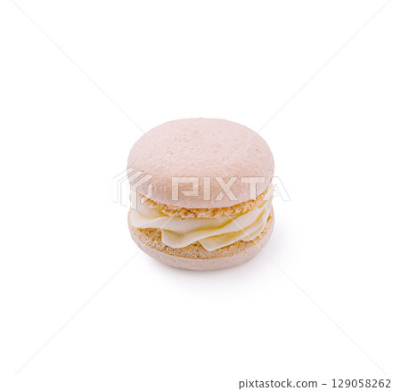 Delicious pink macaroon with creamy filling on a white background 129058262