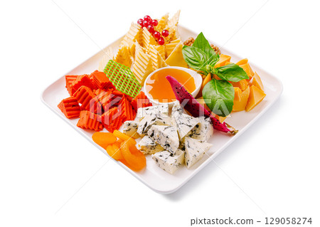 Delicious cheese and fruit platter served at a summer gathering 129058274