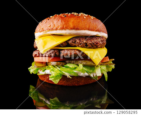 Delicious double cheeseburger made with fresh ingredients and toppings Delicious double cheeseburger made with fresh ingredients and toppings 129058295