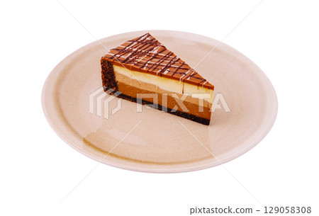Delicious layered chocolate mousse cake served on a plate Delicious layered chocolate mousse cake served on a plate 129058308