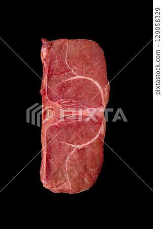 Freshly cut beef steak ready for grilling or roasting preparation Freshly cut beef steak ready for grilling or roasting preparation 129058329