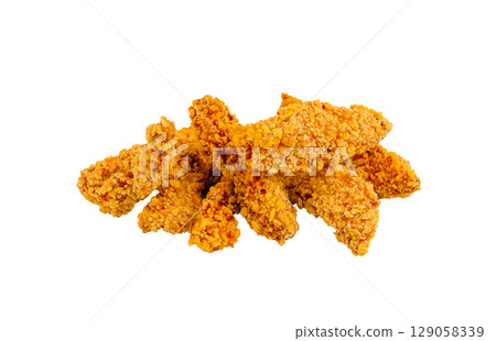 Crispy fried chicken tenders piled high on a white background 129058339