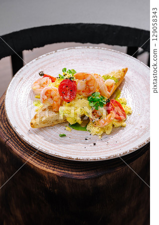 Delicious shrimp and egg toast served on a rustic wooden table 129058343