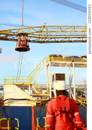 Crews boat moving the passenger and cargo from the platform to supply boat in oil and gas industry. Support offshore oil and gas industry by boat and service team. 129058361