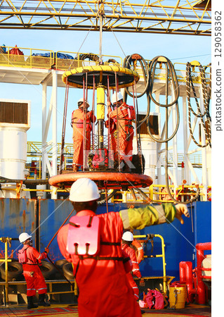 Crews boat moving the passenger and cargo from the platform to supply boat in oil and gas industry. Support offshore oil and gas industry by boat and service team. Crews boat moving the passenger and cargo from the platform to supply boat in oil and gas industry. Support offshore oil and gas industry by boat and service team. 129058362