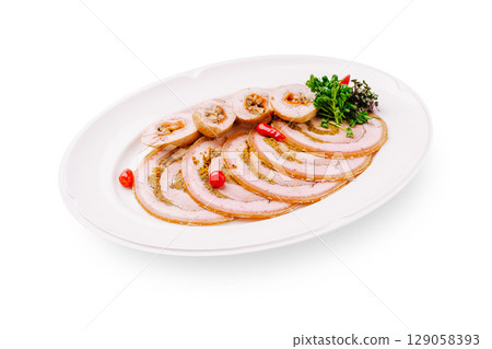 Deliciously prepared rolled meat with herbs and spices on a white platter 129058393