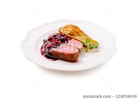 Fine dining plate with duck breast, cherry sauce, and baked pear Fine dining plate with duck breast, cherry sauce, and baked pear 129058439