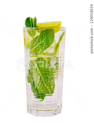 Refreshing mint and lime drink served in a tall glass with ice Refreshing mint and lime drink served in a tall glass with ice 129058634