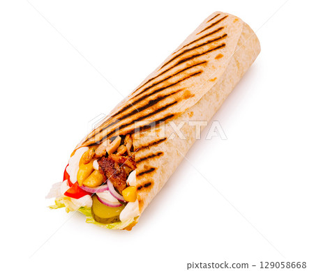 Deliciously grilled wrap filled with fresh vegetables and savory meat 129058668