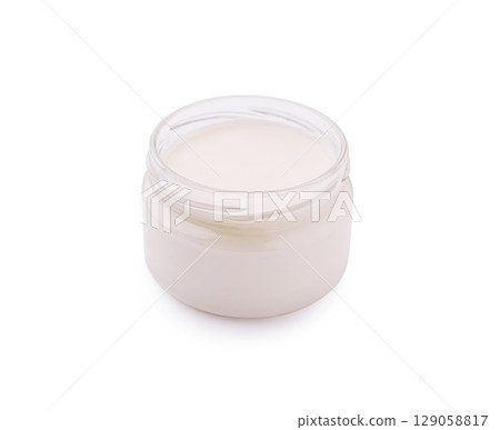 Glass jar of mayonnaise on white background Glass jar of mayonnaise on white background 129058817