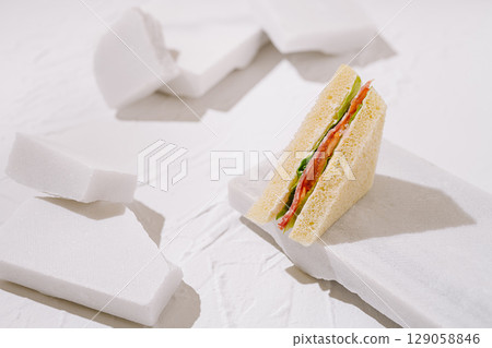 Creative sandwich presentation with unique white background design 129058846