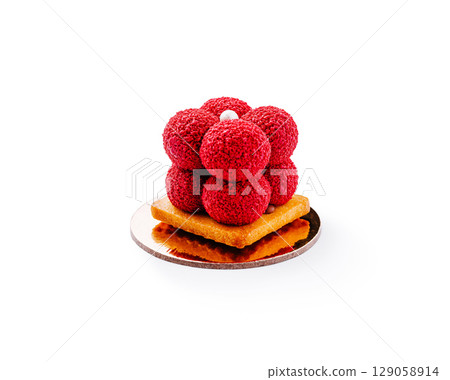 Creative dessert featuring raspberry spheres on a pastry base Creative dessert featuring raspberry spheres on a pastry base 129058914