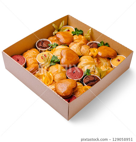 Delicious assorted pastries in a decorative box ready for celebration 129058951