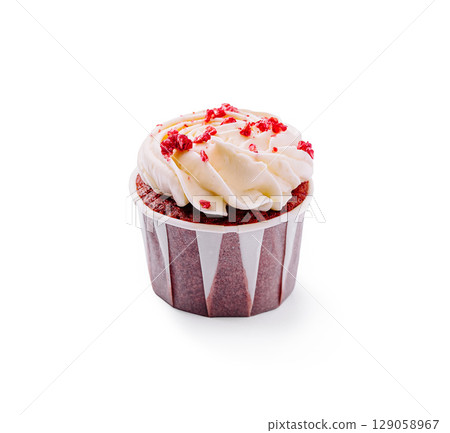 Delicious red velvet cupcake with cream cheese frosting and sprinkles Delicious red velvet cupcake with cream cheese frosting and sprinkles 129058967