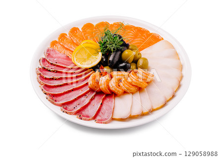 Delicious seafood platter with a variety of fish, shrimp, and olives Delicious seafood platter with a variety of fish, shrimp, and olives 129058988