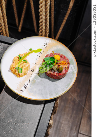 Unique culinary dish featuring vibrant colors and textures on a stylish plate Unique culinary dish featuring vibrant colors and textures on a stylish plate 129059051