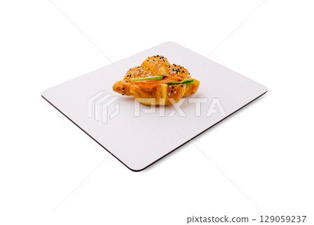 Freshly baked croissant with sesame seeds on a white plate Freshly baked croissant with sesame seeds on a white plate 129059237