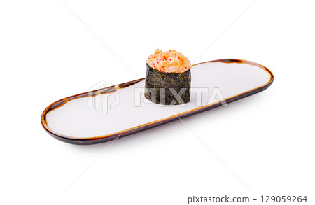 Sushi with spicy tuna on decorative plate ready for serving at restaurant Sushi with spicy tuna on decorative plate ready for serving at restaurant 129059264