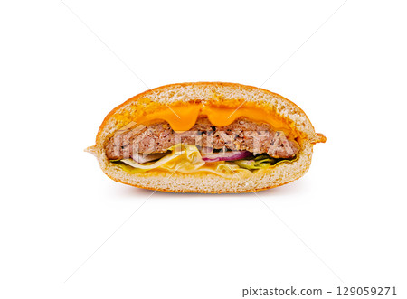 Juicy burger with melted cheese and fresh vegetables in a bread roll Juicy burger with melted cheese and fresh vegetables in a bread roll 129059271