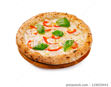 Delicious pizza topped with fresh ingredients and basil served on a wooden board Delicious pizza topped with fresh ingredients and basil served on a wooden board 129059441