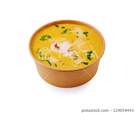 Delicious seafood soup served in a disposable bowl with fresh herbs Delicious seafood soup served in a disposable bowl with fresh herbs 129059443