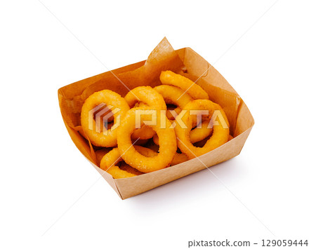 Delicious golden onion rings served in a takeout box at a food stand Delicious golden onion rings served in a takeout box at a food stand 129059444