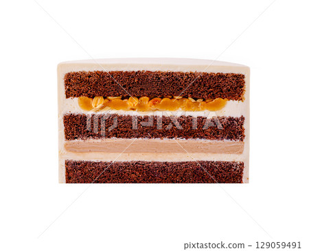 Delicately layered chocolate cake with creamy filling and nuts 129059491
