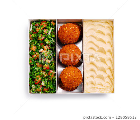 Delicious Mediterranean dinner box featuring falafel, hummus and salad Delicious Mediterranean dinner box featuring falafel, hummus and salad 129059512