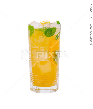 Refreshing citrus beverage served over ice with mint leaves and lemon twist 129059517