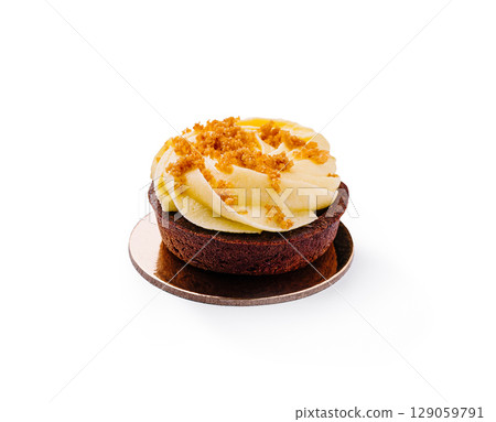 Delicious chocolate cupcake decorated with creamy frosting and crumbs Delicious chocolate cupcake decorated with creamy frosting and crumbs 129059791