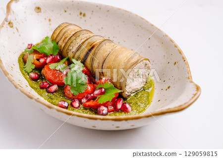 Unique presentation of grilled vegetables with fresh pomegranate and herbs Unique presentation of grilled vegetables with fresh pomegranate and herbs 129059815