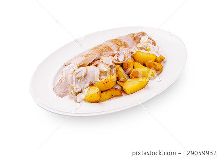 Sliced chicken with roasted potatoes and creamy sauce served on a plate Sliced chicken with roasted potatoes and creamy sauce served on a plate 129059932