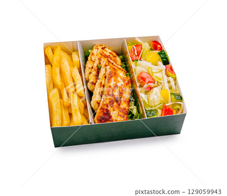 Tasty meal with grilled cheese or chicken, fries, and fresh salad, beautifully presented 129059943