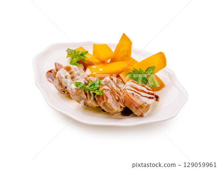 Savory grilled chicken skewers served with fresh mango slices and herbs Savory grilled chicken skewers served with fresh mango slices and herbs 129059961