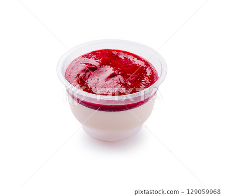 Delicious raspberry panna cotta served in a clear plastic cup 129059968