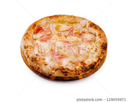 Delicious freshly baked pizza topped with ham and cheese on a wooden board 129059971