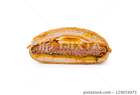 Delicious meat sandwich served with pickles and spicy sauce 129059973