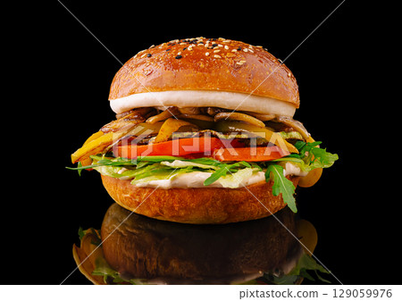Delicious gourmet burger with fresh vegetables and melted cheese 129059976