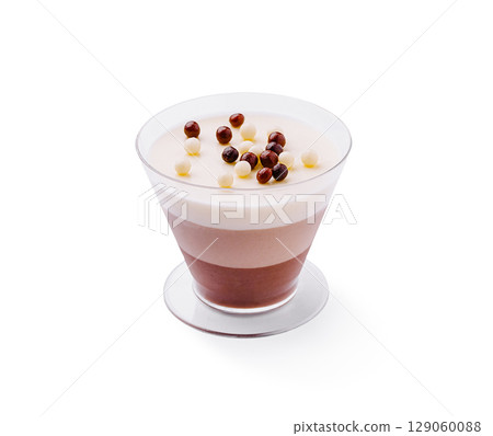 Chocolate and cream dessert in layered glass cup with toppings Chocolate and cream dessert in layered glass cup with toppings 129060088