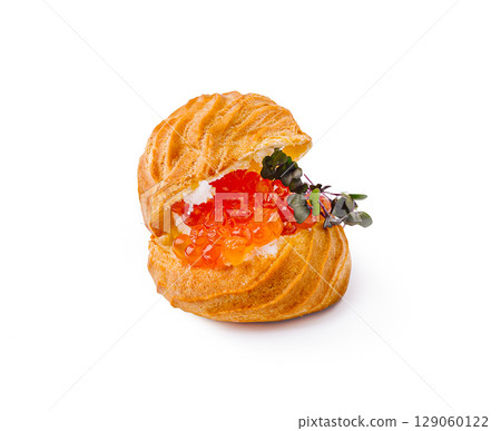 Gourmet pastry filled with creamy topping and vibrant caviar Gourmet pastry filled with creamy topping and vibrant caviar 129060122