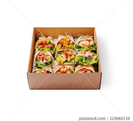 Healthy wraps in a cardboard box displayed on a white surface 129060138