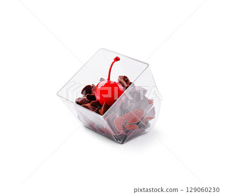 Delicious chocolate dessert served in a clear cup with a cherry on top Delicious chocolate dessert served in a clear cup with a cherry on top 129060230
