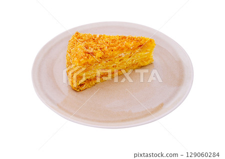 Delicious slice of cake served on a simple plate in natural light Delicious slice of cake served on a simple plate in natural light 129060284