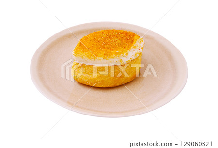 Delicious dessert featuring a fluffy pastry topped with sweet cream Delicious dessert featuring a fluffy pastry topped with sweet cream 129060321
