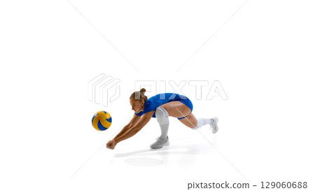 Female volleyball player dives to hit ball on white background Female volleyball player dives to hit ball on white background 129060688